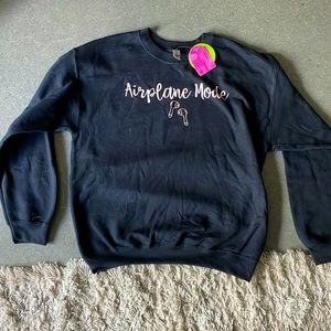 Black cotton crew neck sweatshirt with “airplane mode” on it. Never been worn